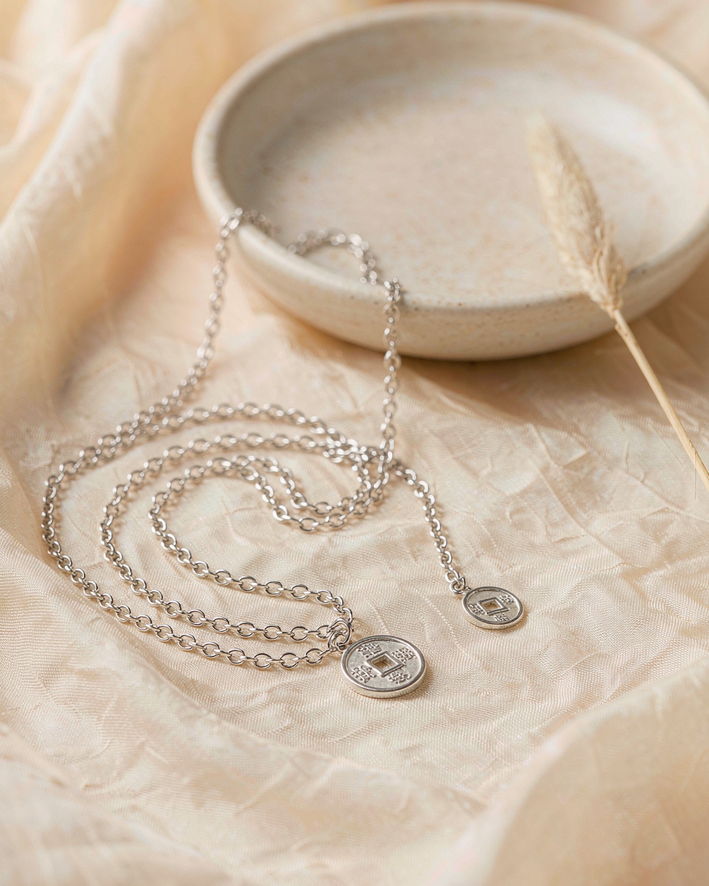 Silver Chinese coin pendant necklace with a square-hole coin on cream silk